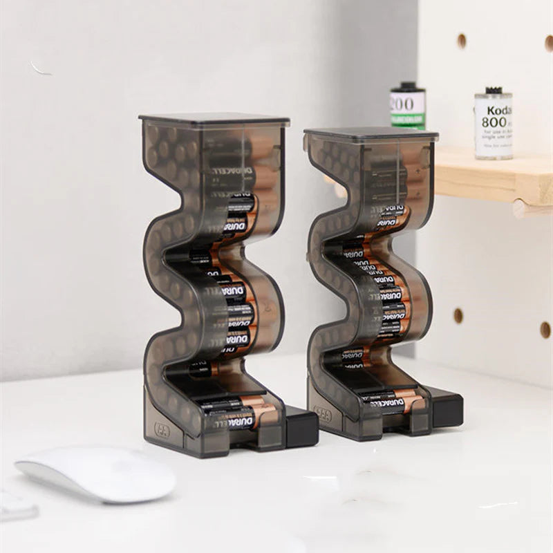 Magnetic battery tester and storage case suitable for AA and AAA batteries.