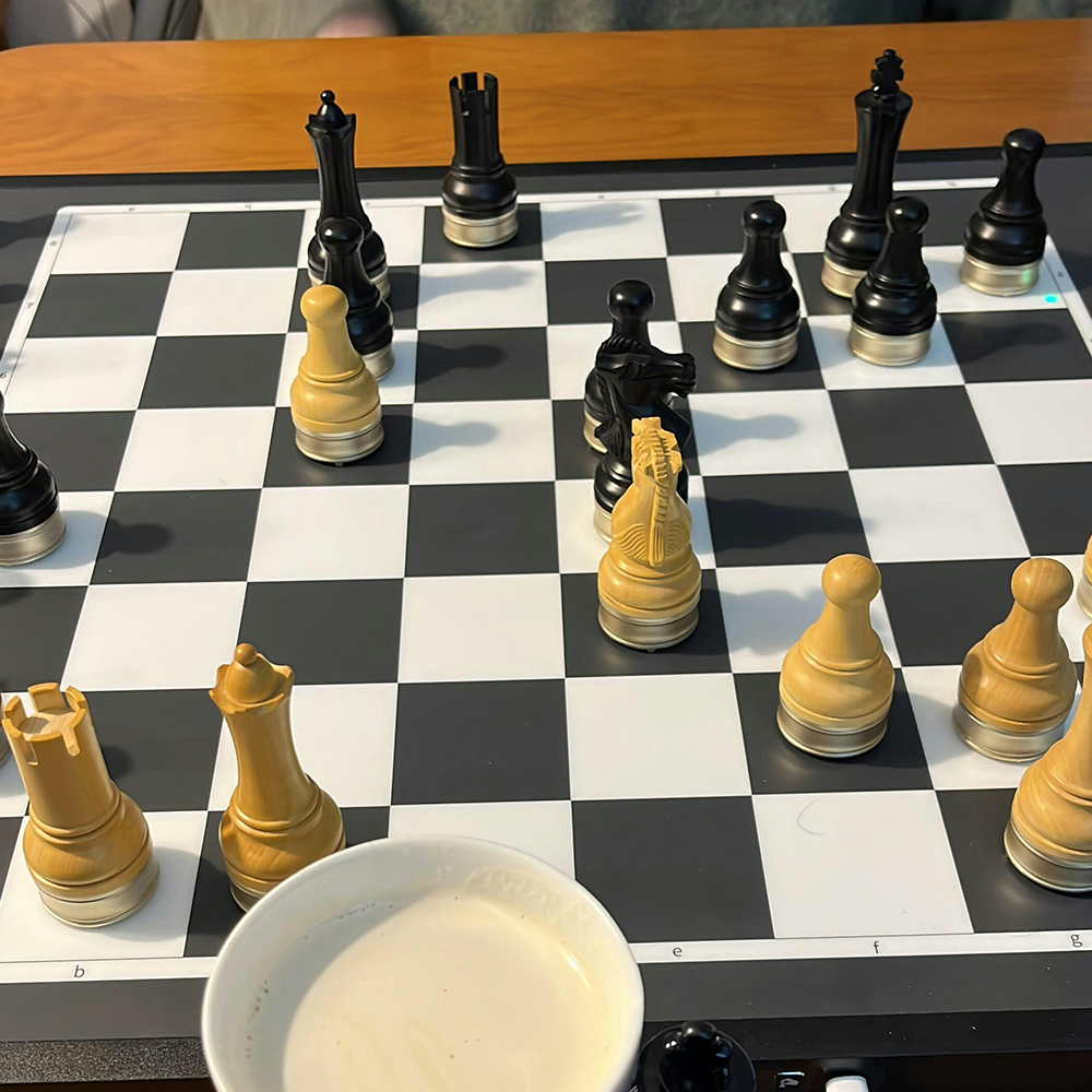 Advanced robotic chessboard with wooden chess pieces